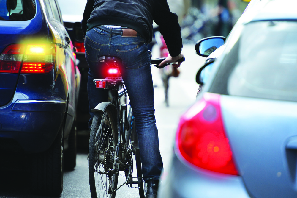 Bike and car on road