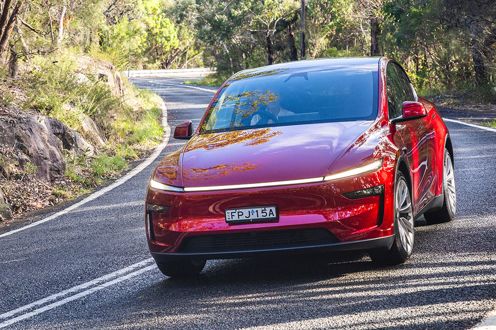 2025 Tesla Model Y on the  road.
