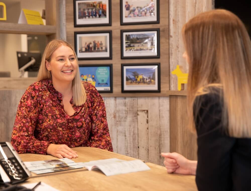 RACQ staff member talking to member