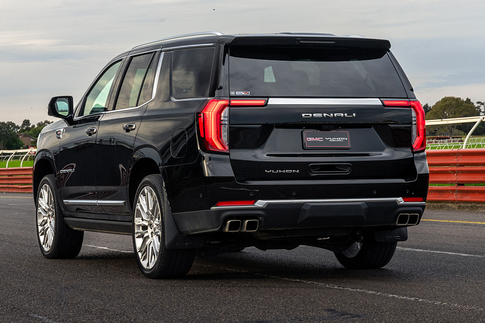 GMC Yukon Denali SUV rear view.