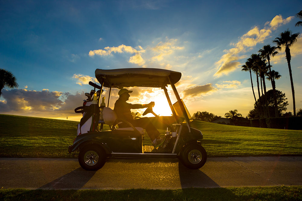 Man driving a golf cart