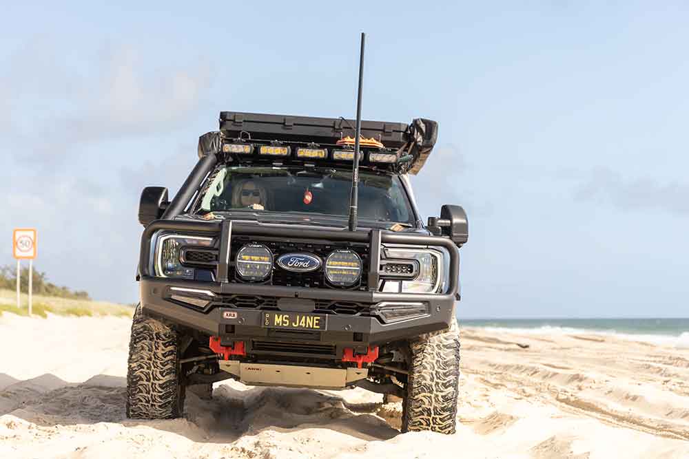 Jane Cartwright behind the wheel of her Ford Ranger on Bribie Island.
