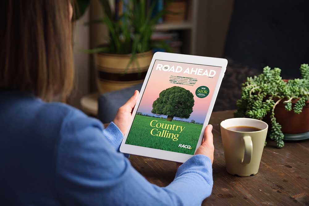 Woman reading Spring 2026 edition of The Road Ahead on tablet.