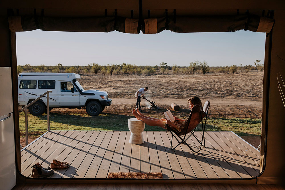 Couple relaxing at Mitchell Grass Retreat, Longreach.