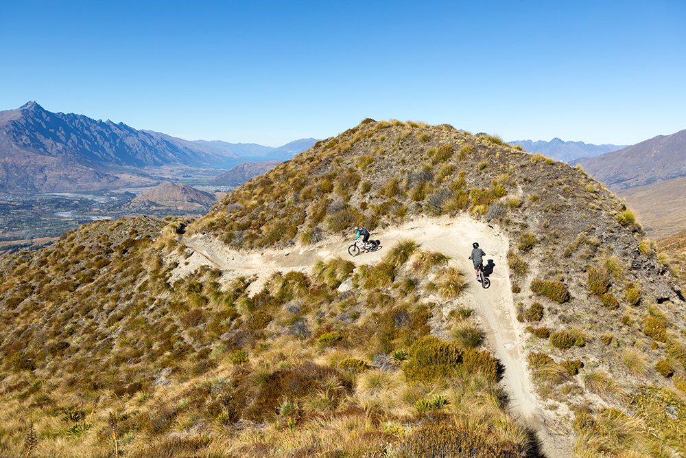 Mountain bikers on Coronet Peak Trail near Queenstown.