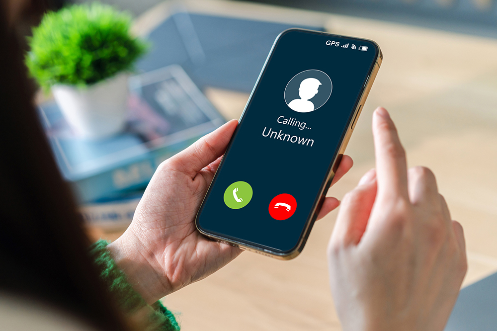 Image of mobile phone with call from unknown  number.