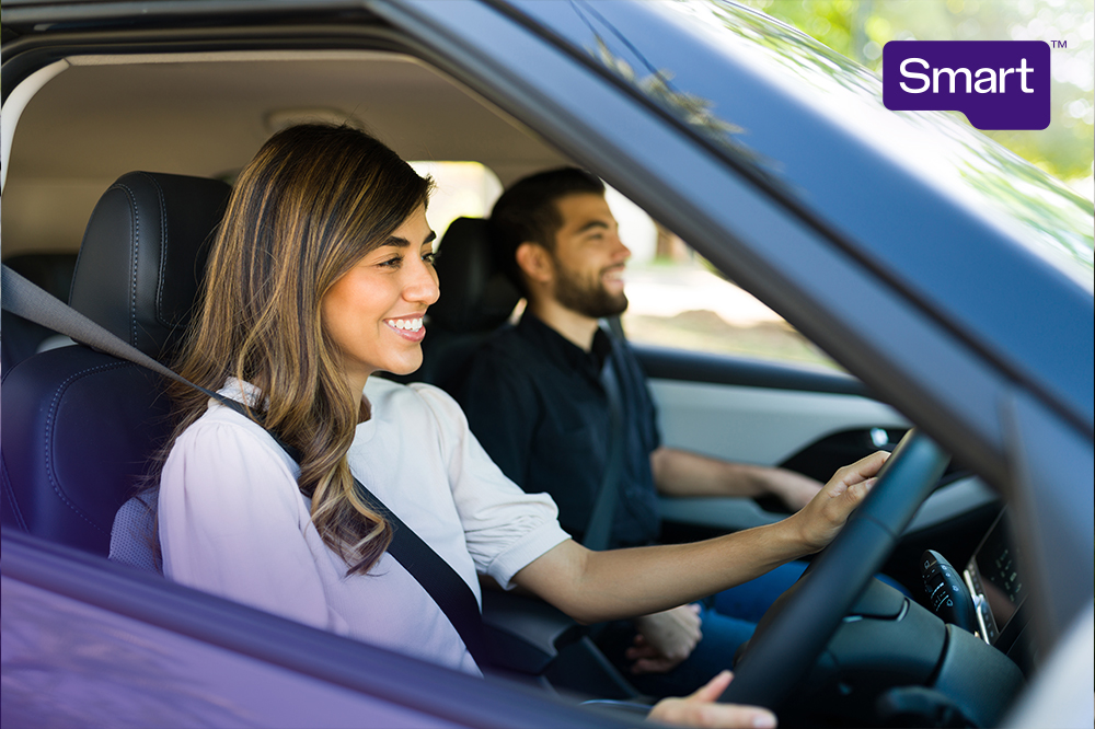 Woman behind the wheel of a car.