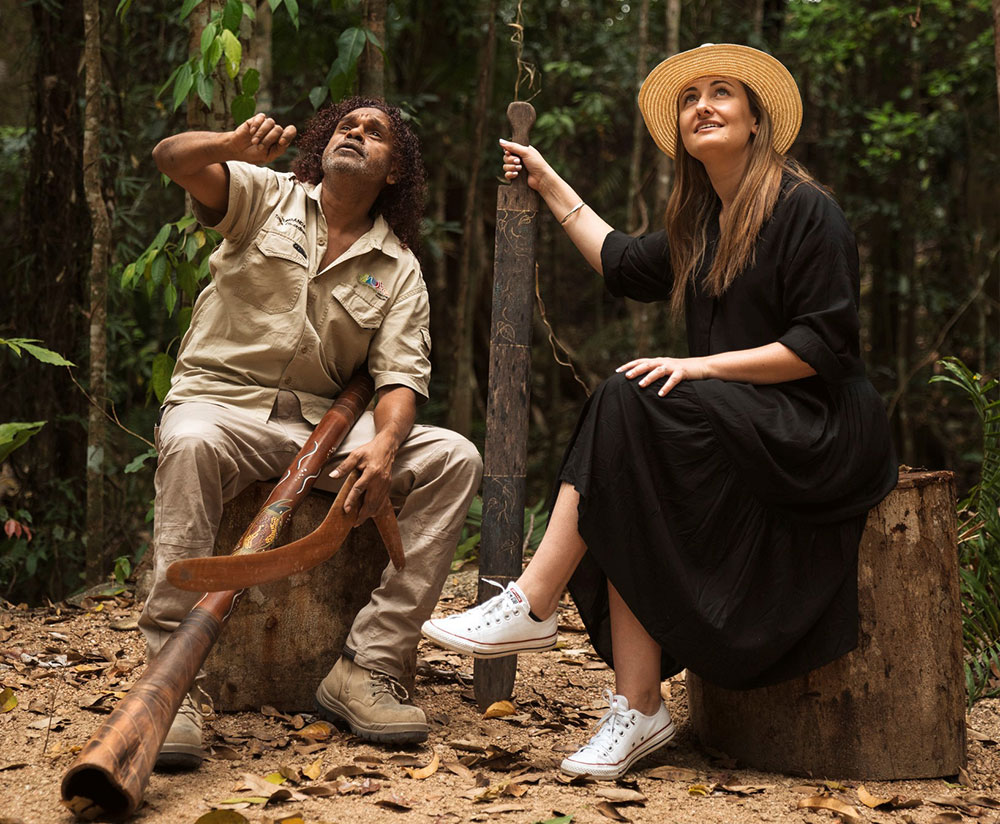 A guide talks to a visitor to Mossman Gorge.