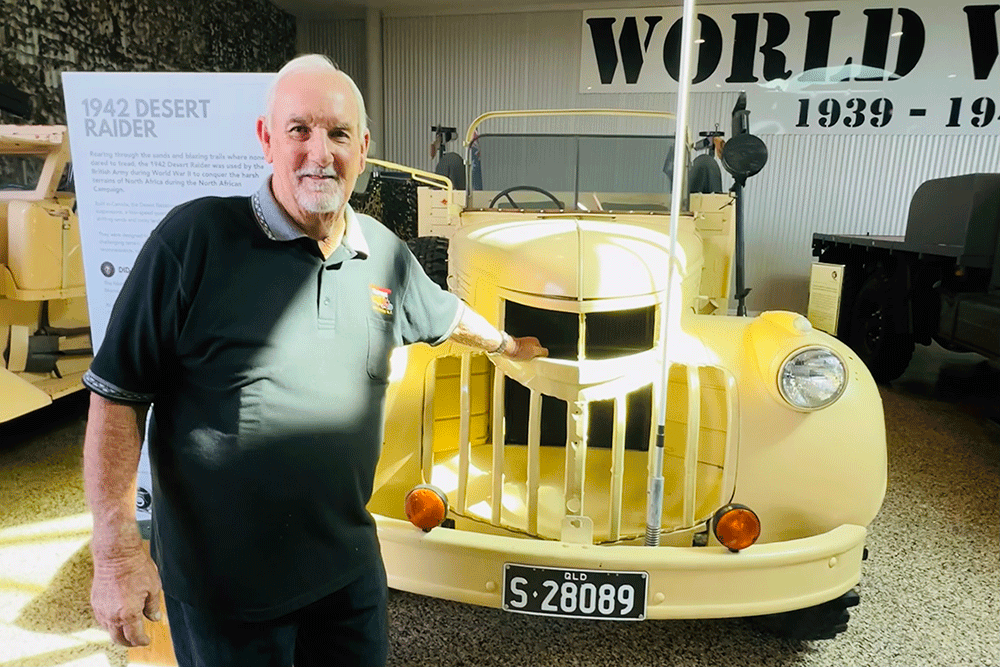 Clive Barton with the 1942 Desert Raider on display at Queensland Museum.