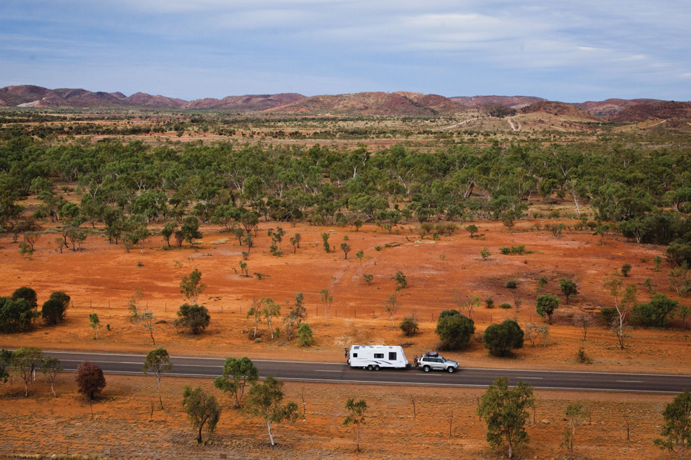 Car towing caravan on the Overlanders Way.