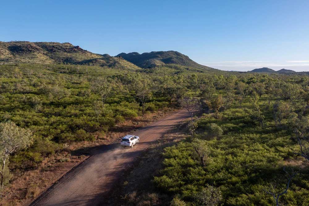 Vehicle on a dirt road in North West Queensland, off the Big Sky Drive.