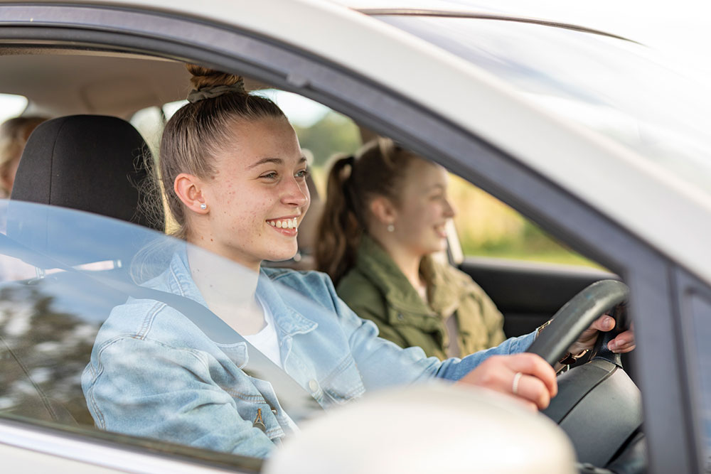 car seat behind passenger or driver