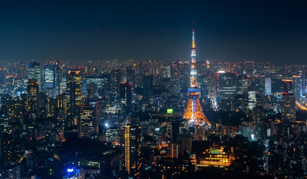 Tokyo cityscape at night with tokyo tower lit up red