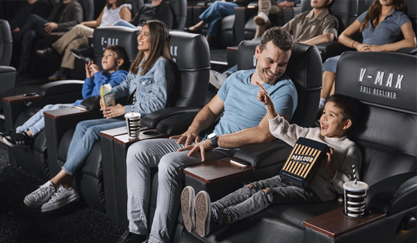 family at event cinemas watching screen